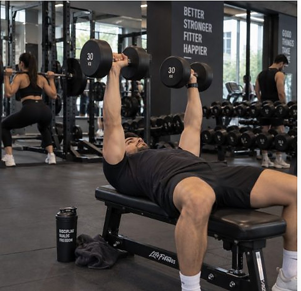 A dumbbell bench press mid-set.